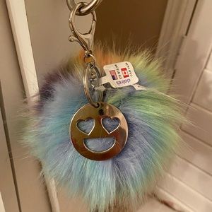 Pompom keychain with smiley face charm